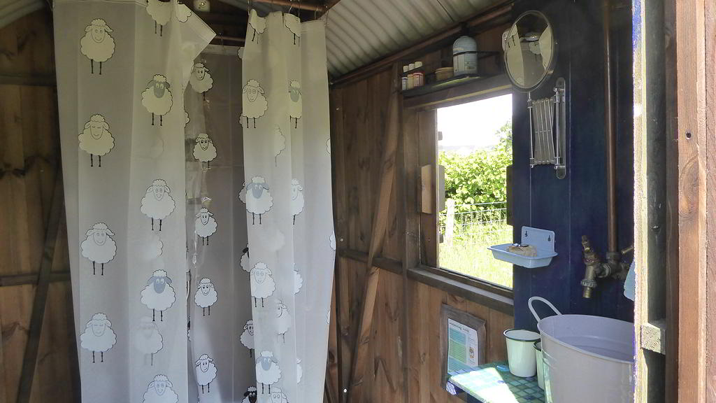 Shower and window in the lavatory Hut