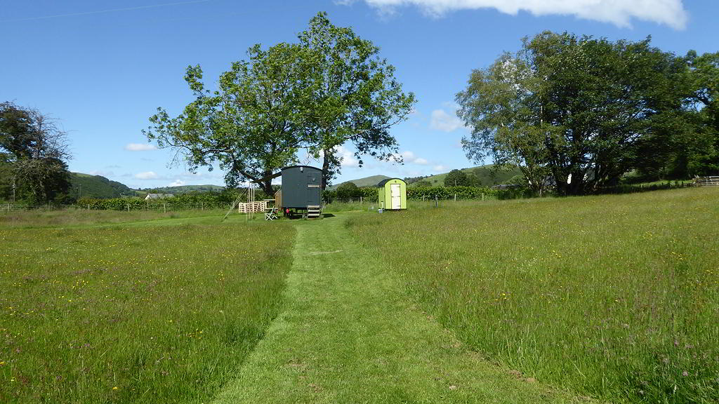 View of Hygge Hut with tree and hills in the background 2