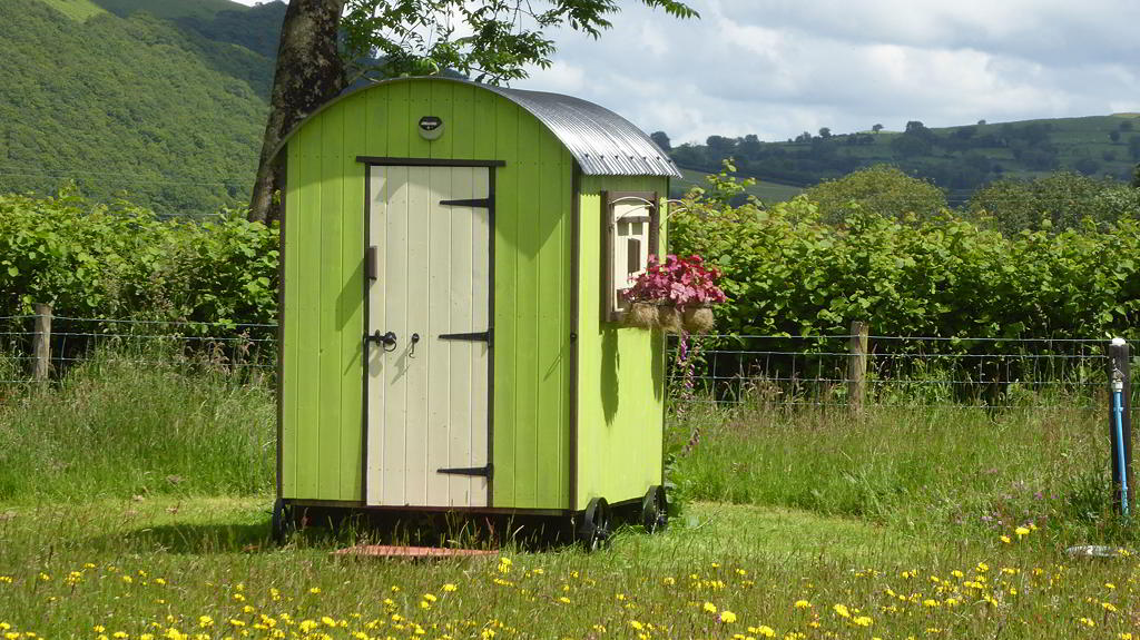 View of the lavatory hut and hills in the background