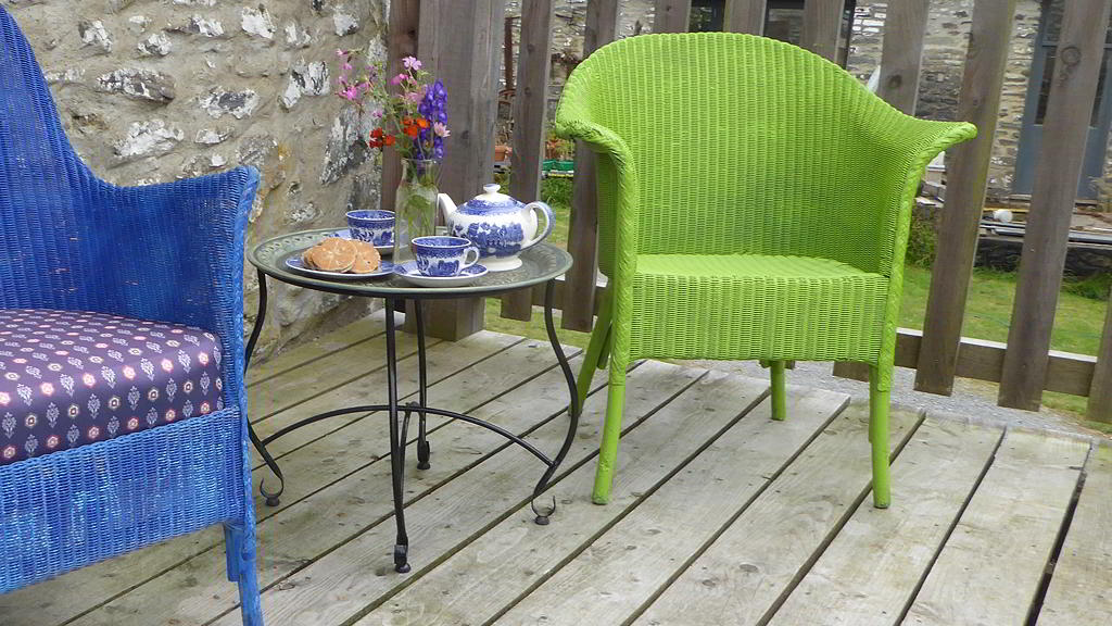 Chairs and table set for tea on Y Granar Balcony