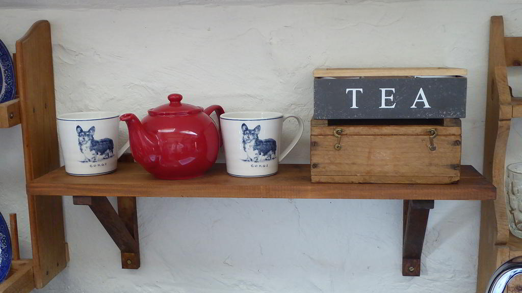Tea pot, box of tea and dog mugs